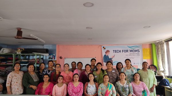 A group of women pose for a picture.