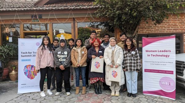 The participants pose for a picture with project merch after the session.